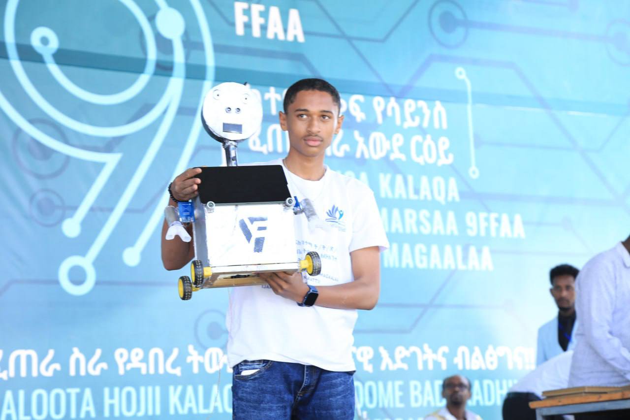 Yafet Anteneh with TESS Robot